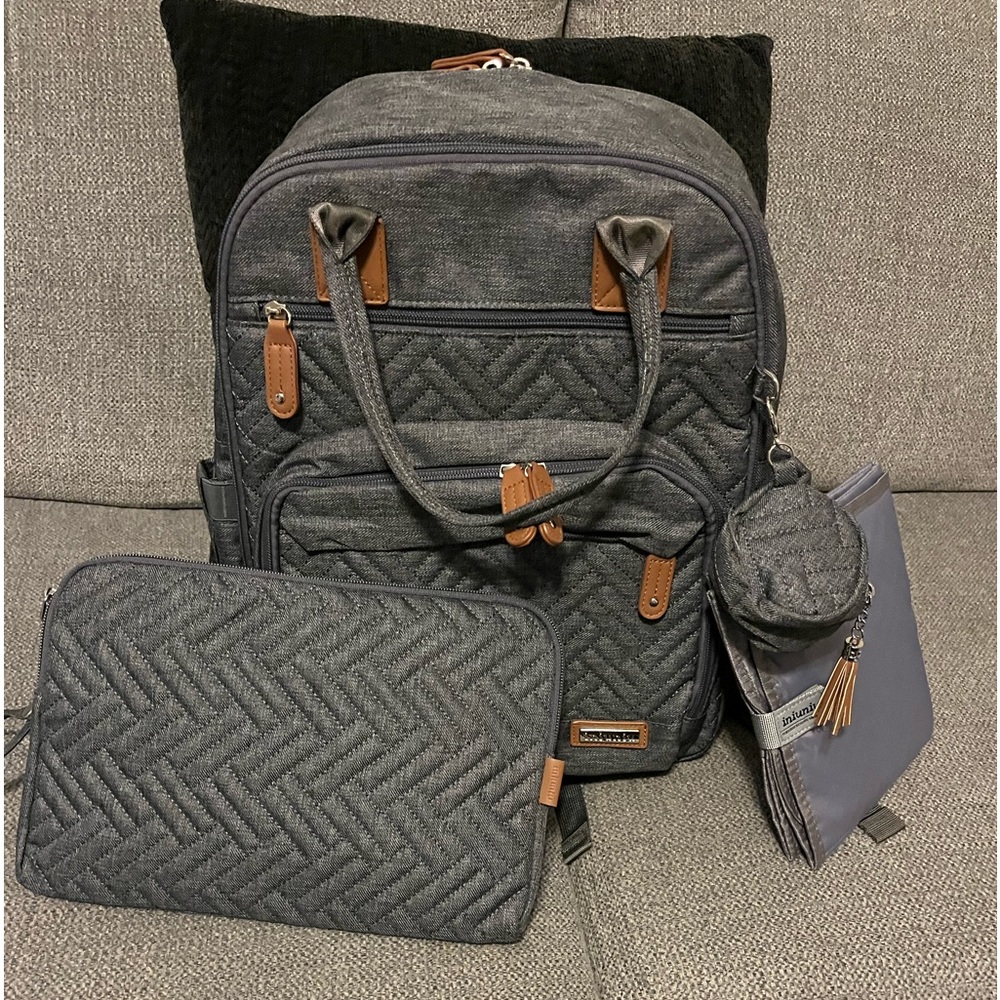 Gray backpack, style diaper bag with changing pad and pacifier holder. New WOT